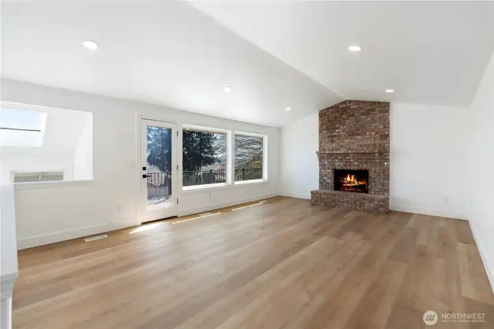 Spacious living area with deck access.