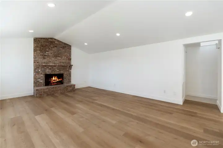 Spacious living area with fireplace, perfect for relaxing or entertaining.