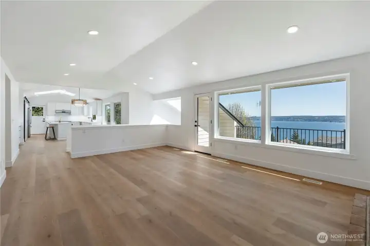 Seamless connection between living, dining, and kitchen spaces.