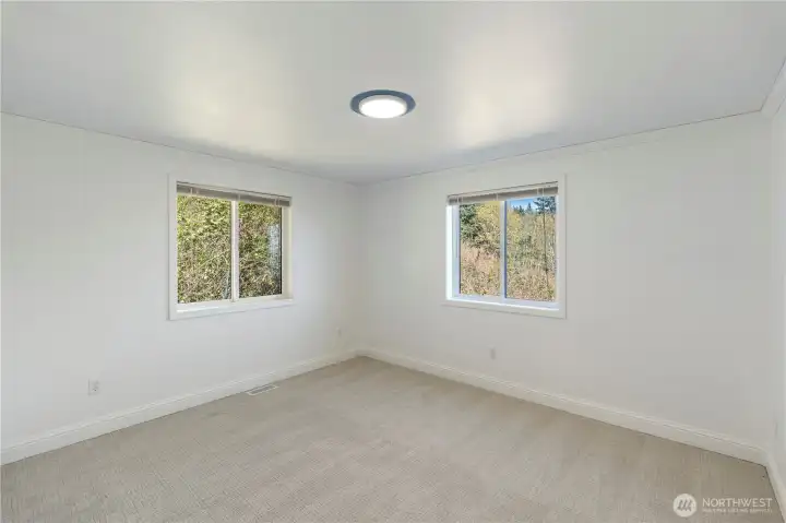 Spacious secondary bedroom with ample closet space.