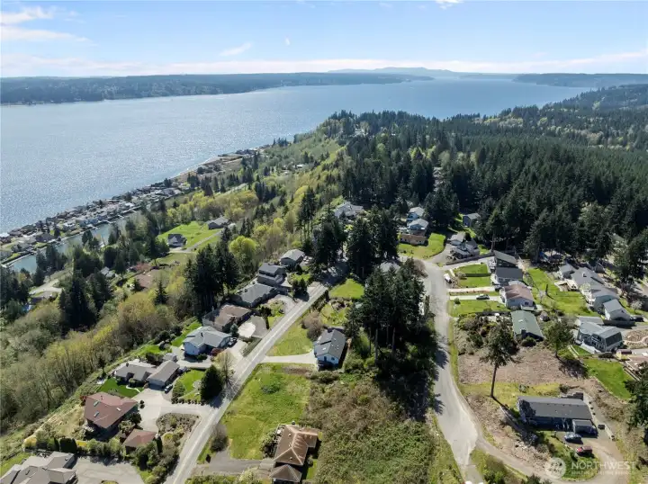Breathtaking aerial view showcasing the neighborhood’s stunning proximity to the shoreline.