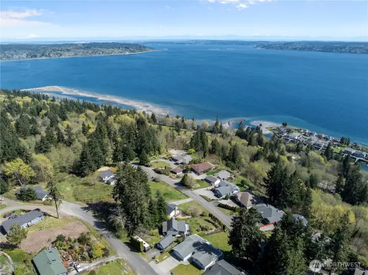 Bird's-eye view of the rugged coastline and the tranquil waters of the sound.