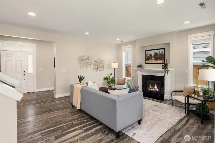 Note the low maintenance wood laminate flooring throughout