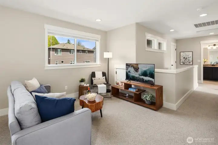 Upper level loft is the perfect media room, bonus or play space!