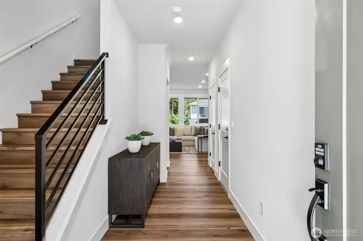 Light and bright entry highlighted by 9' ceilings, which is consistent on all levels of the home.  Photo is same floor plan on Lot 1-homesite details can vary-see site agent