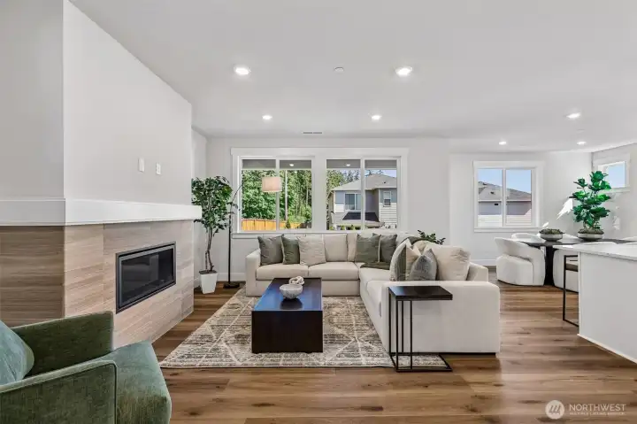 Looking into great room from the entry hall featuring hard surface flooring throughout the main level. Photo is same floor plan on Lot 1-homesite details can vary-see site agent
