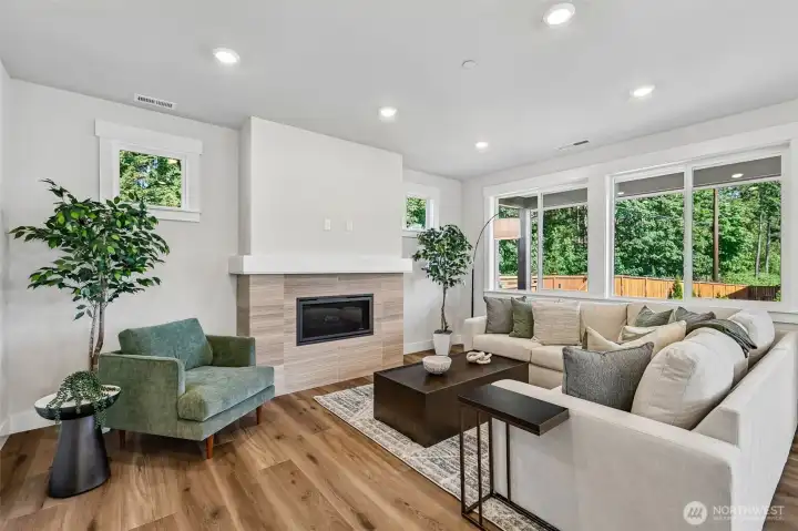 Generous wood wrapped windows stream light into the great room. Photo is same floor plan on Lot 1-homesite details can vary-see site agent