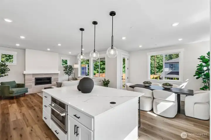 Open concept main level with access to covered rear yard deck. Photo is same floor plan on Lot 1-homesite details can vary-see site agent