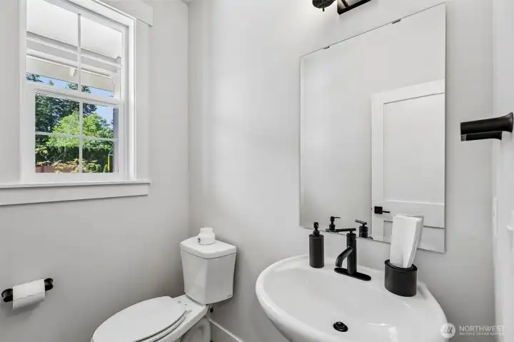 Convenient powder room on the main level. Photo is same floor plan on Lot 1-homesite details can vary-see site agent