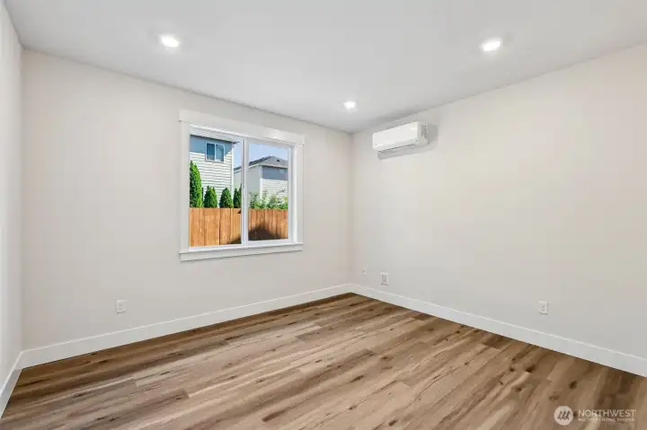 Lower level bedroom overlooking rear yard provides a guest retreat. Photo is same floor plan on Lot 1-homesite details can vary-see site agent