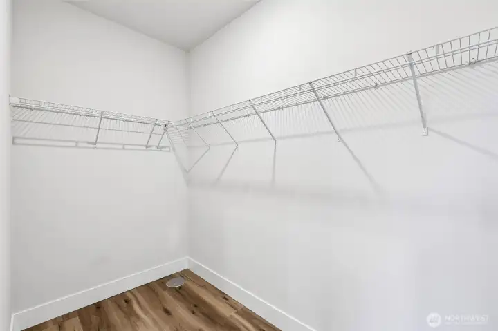 Lower level bedroom offers ample storage with a walk-in closet. Photo is same floor plan on Lot 1-homesite details can vary-see site agent