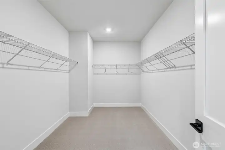 The huge primary bedroom closet must be seen to be believed. Photo is same floor plan on Lot 1-homesite details can vary-see site agent
