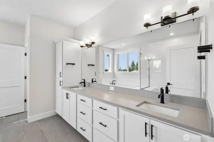 Primary bath dual sink vanity provides storage galore. Photo is same floor plan on Lot 1-homesite details can vary-see site agent