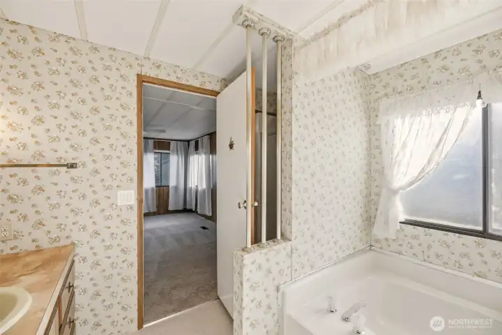 Shower behind the door. Large soaking tub.
