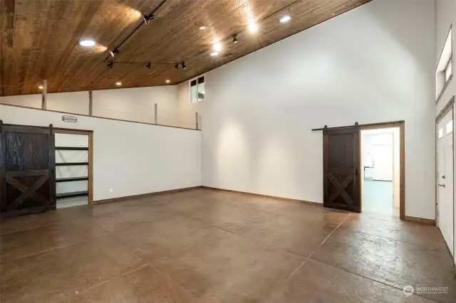 Exhibition room w/loft - stamped & stained concrete, 1/2" plywood on walls