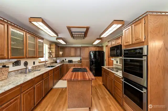 Chef's kitchen - double oven, butcher block island, granite countertops