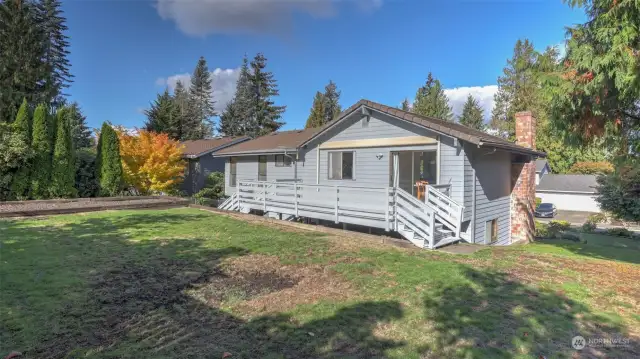 A view looking to the back of the home, showcasing the ample yard space this home offers.