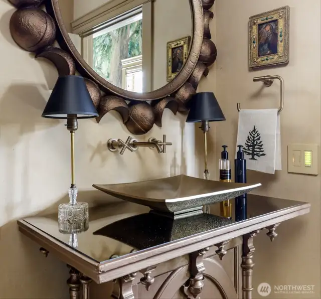 The custom gold vanity with a smoked mirror is absolutely jaw-dropping.