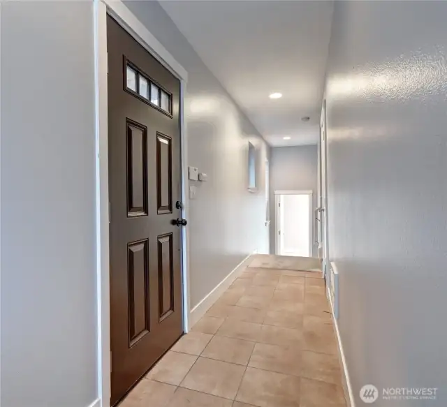 Entry to home. 3rd bedroom and private bathroom straight ahead.