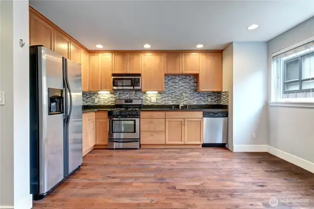 Another view of large kitchen with natural light.