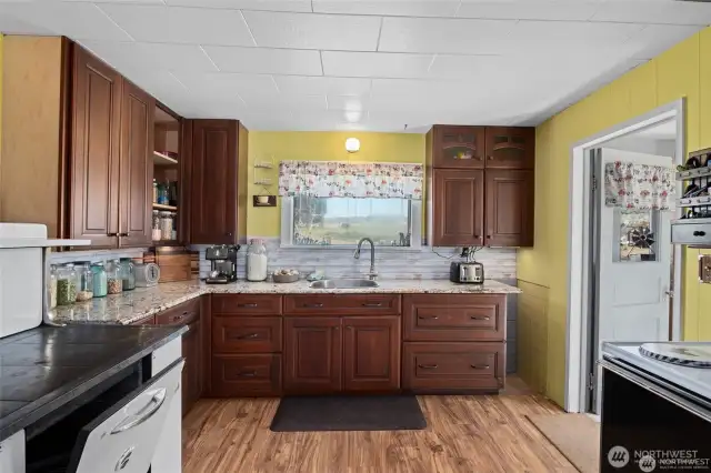 Kitchen with new cabinets & granite countertops.