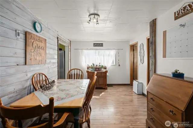 Dining room with barnwood accented wall.