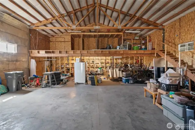 Shop has storage in the back and more storage in the loft above.
