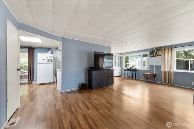 The home has an attractive double door from the carport entrance which can be seen to the left of this photo. Look at those beautiful laminate floors!