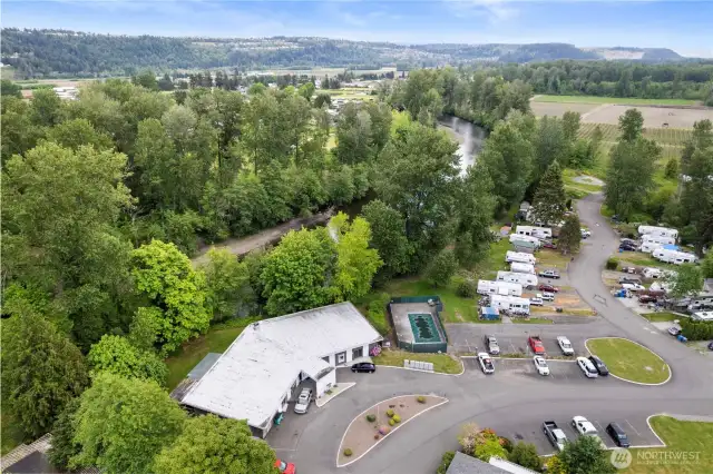 The clubhouse and Puyallup River. The Bowman Hilton community pool can be seen to the right of the clubhouse