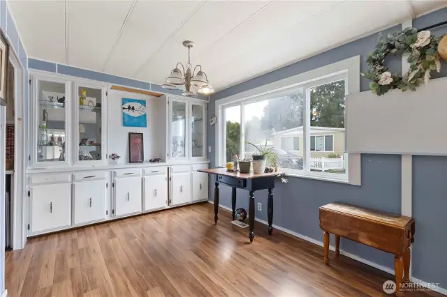 The dining area and attractive built in cabinets