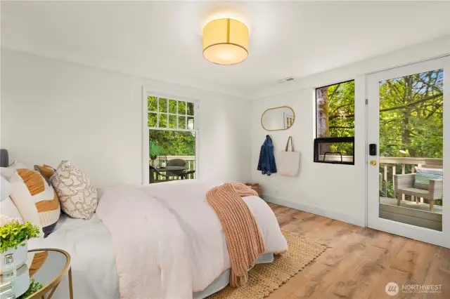 Second lower level bedroom.  Also has access to the back deck that wraps around the home