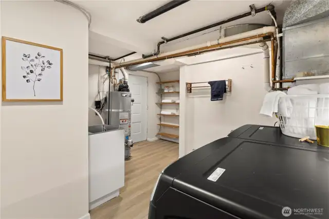 Lower level utility room lots of space for additional storage, large W/D, Stand alone sink as well as access to the wraparound deck