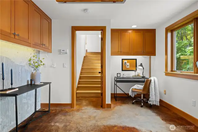 Plenty of space in this living area of the tattoo that doorway leads you up to the bedroom and down to the kitchen and the three-quarter bath