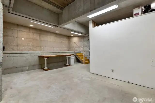 This is the additional storage room. It’s a huge space with heated floors.  The additional space straightahead was originally planned to be walled in to make a dark room.