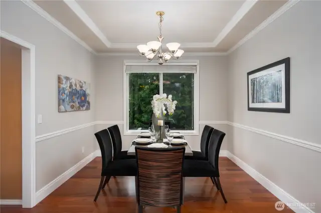 From the large living room, the space opens to a formal dining room.