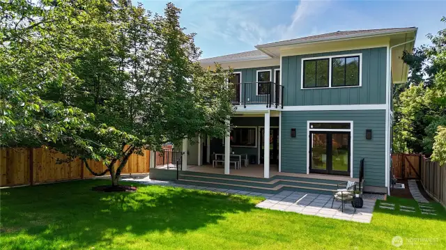 Amazing huge backyard is level, fully fenced, grassy and connected directly to the living room and kitchen.
