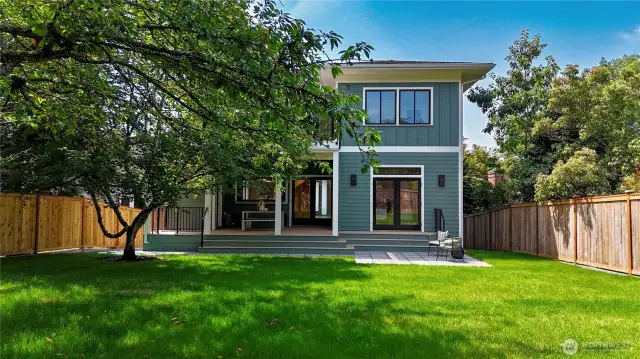 Amazing huge backyard is level, fully fenced, grassy and connected directly to the living room and kitchen.