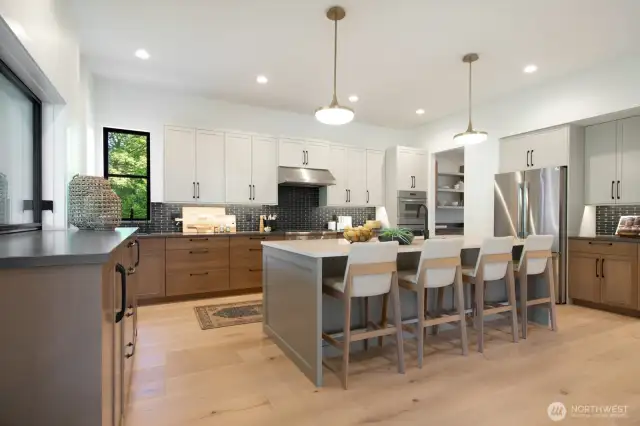 Great kitchen is the heart of the home. Open to both the living and outside. Notice the very cool pass through window to the left, and butlers pantry to the right.