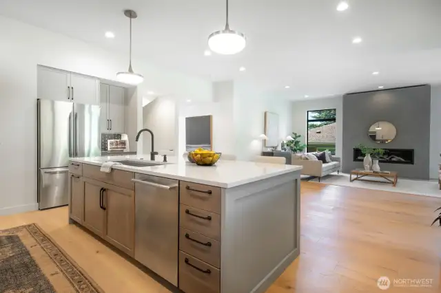 Kitchen is open to the living room. High ceilings make the space feel light and airy.