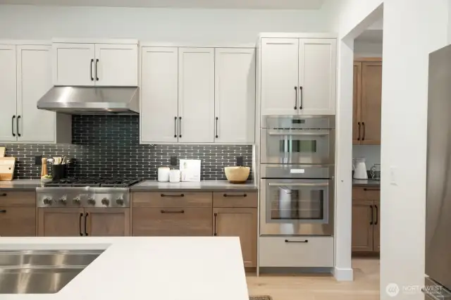 Kitchen has quality finishes. Notice the Butlers pantry to the right.