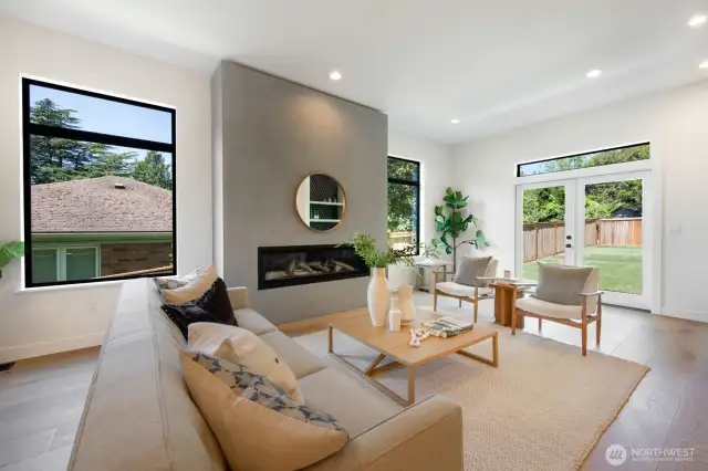 Epic huge level grassy and fenced backyard, directly off the kitchen and main floor living room.