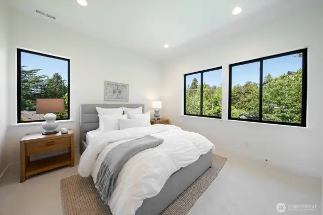 3/4 bedrooms on the top floor; check out all of the greenery out the window.