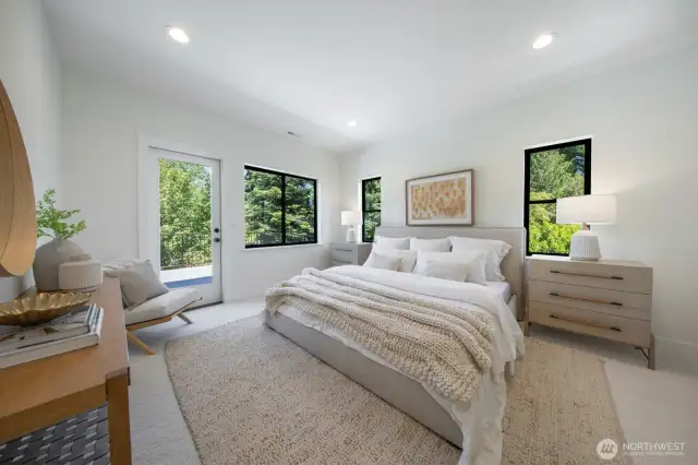Primary bedroom overlooks backyard and has direct access to the roof top deck.