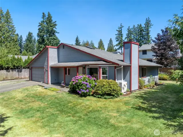 Spacious, level lot with grassy lawns for play and entertaining - plus raised garden beds and a well-maintained rambler at the heart of it all.