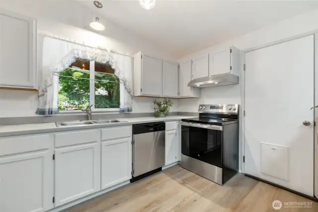 Well-equipped with modern appliances and ample counter space—this kitchen offers both charm and practicality.
