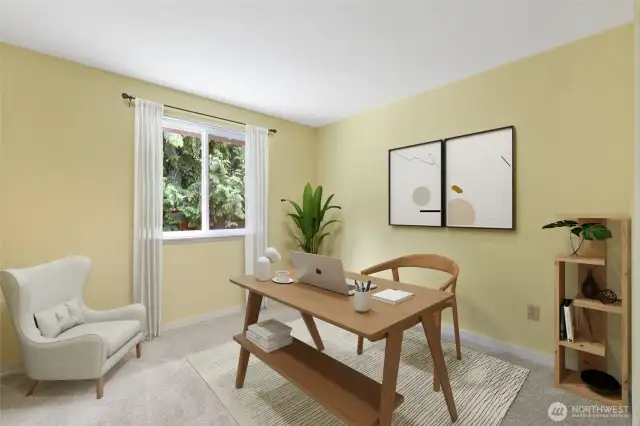 Freshly carpeted and filled with soft natural light, this quiet room offers flexibility as a home office, guest space, or cozy retreat with a peaceful view of evergreens. (Virtually Staged)