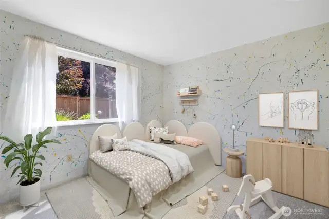 With new carpet and views of colorful garden beds, this bright room is perfect as a bedroom, playroom, or creative corner(Virtually Staged)