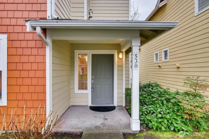 Detailed view of the entryway showcasing covered access and strong curb appeal.