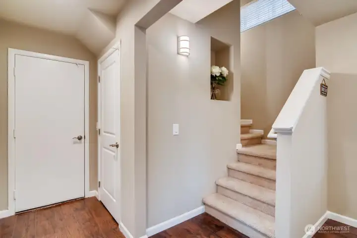 Entryway with a welcoming design and view of the staircase leading to main living areas.