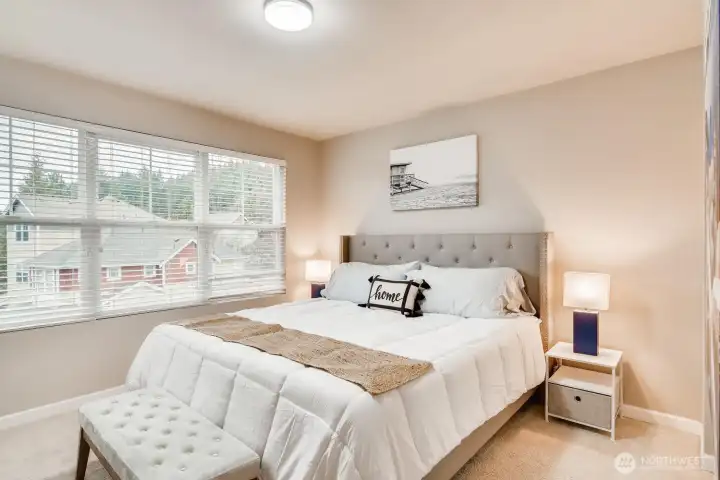Primary suite on the third floor featuring ample space. Includes  an ensuite bath (not pictured).
